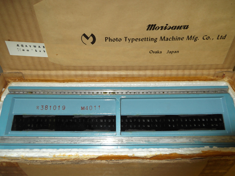 Film font for a Morisawa phototypesetting system, circa mid-1960s. Photo by Flickr user @themostinept, December 2012. License: Creative Commons — Attribution-ShareAlike 2.0 Generic https://creativecommons.org/licenses/by-sa/2.0/.